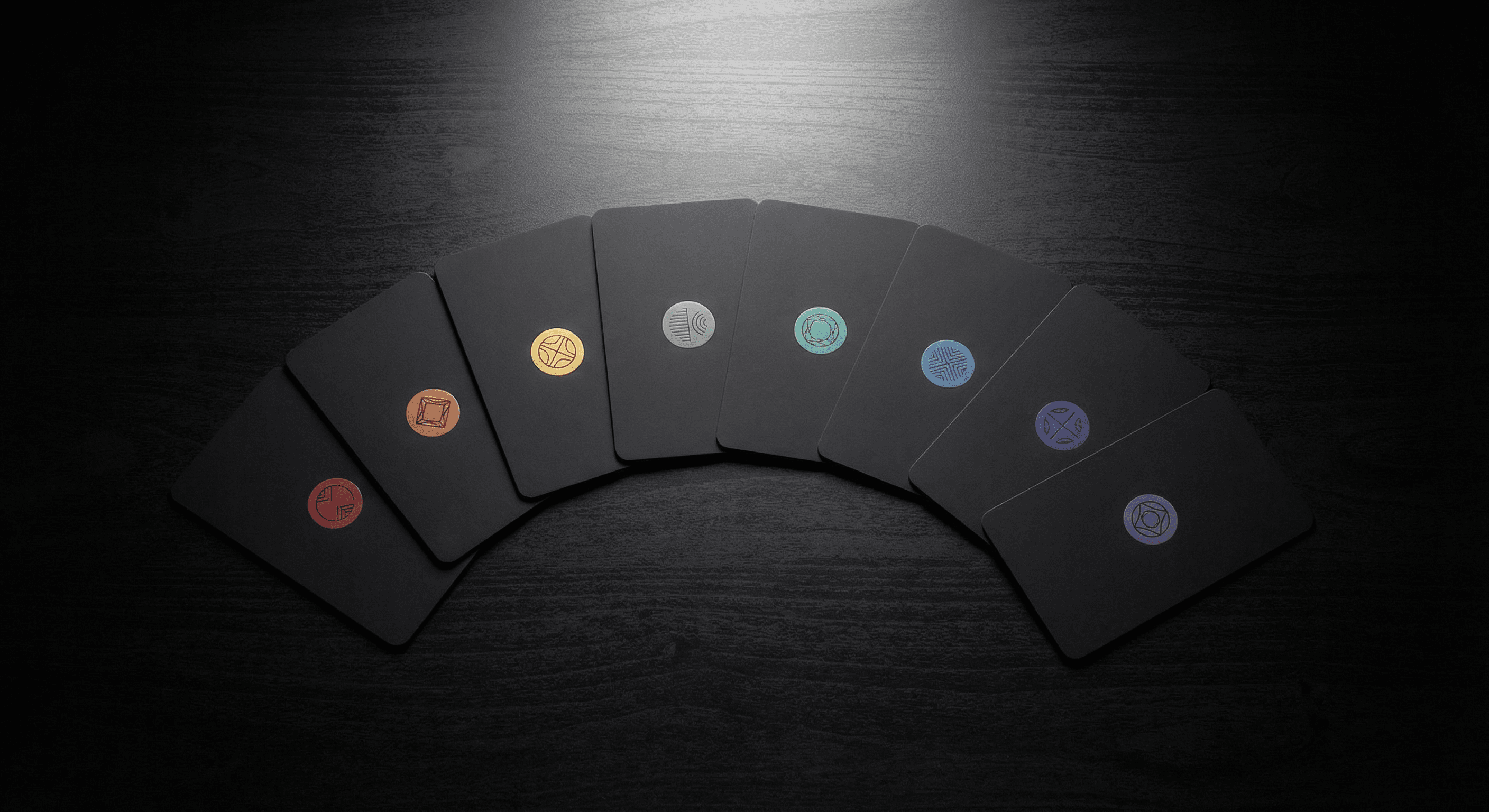 A fan of dark FileSeal cards, each marked with a coloured seal, on a dark surface